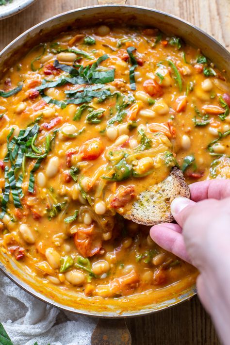 The comforting flavors of this Creamy Vegan Tomato White Bean Stew make the perfect easy lunch or dinner. This dairy-free & plant-based recipe is packed with wholesome ingredients, like protein-packed white beans, cherry tomatoes, and nutrient-dense greens. Learn how to make this easy and satisfying vegan stew in just 25 minutes. Beans Tomato Recipe, Plant Based Easy Dinner, Bean Based Meals Healthy, Easy Veggie Bowls, Protein Dense Dinner, Nutrient Packed Meals, Few Ingredient Meals Vegetarian, Easy Fast Healthy Lunch Ideas, Easy Lunch Ideas Dairy Free