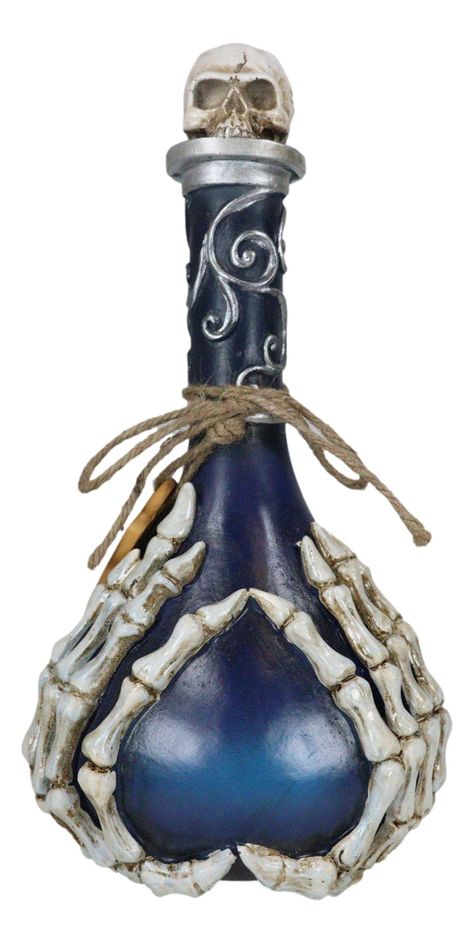 PRICES MAY VARY. This Blue Potion Bottle With Skeleton Fingers is made of polyresin, hand painted and polished individually. The sculpture does NOT store any potion or liquids. It is strictly decorative. The lid does not open/come off. This Blue Potion Bottle With Skeleton Fingers measures 12.25" High and 6.25" Wide. It weighs about 1.75 pounds. This unusual bottle looks as though it has just been taken from an apothecary. Painstakingly painted and designed, the potion bottle boasts of intricate Witchcraft Black Magic, Skeleton Fingers, Magic Potion Bottles, Skeleton Finger, Topper Halloween, Liquor Bottle Crafts, Halloween Potion Bottles, Halloween Bottles, Blue Drinks