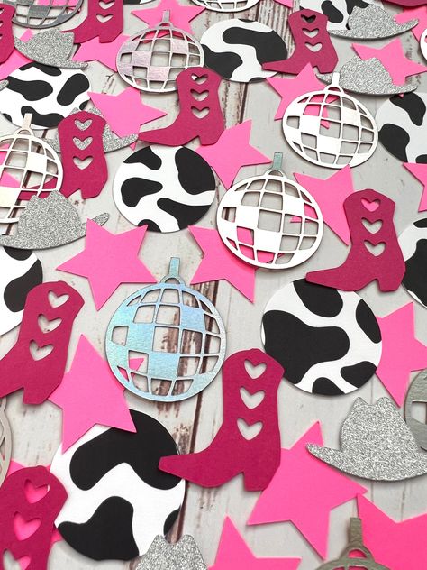 Its time to pour yourself a cup of ambition and party like Parton! This confetti is the perfect addition to a Dolly or disco cowgirl themed party. One pack comes with about 85 pieces The pieces are 1"-1.75" in size. Colors- Metallic Silver Silver Glitter Hot Pink Dark Pink Cow Print Disco Cowgirl 1st Birthday Party, Thirty Flirty And Thriving, Disco Decorations, Cowboy Theme Party, Pink Bachelorette, Cowgirl Birthday Party, Cowboy Theme, Cowgirl Birthday, Party Pictures