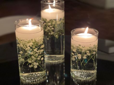 Water Flower Centerpieces, Floating Candle With Baby Breath, Baby’s Breath With Floating Candles, Floating Candles And Babys Breath, Candle Vase Centerpieces Wedding, Fancy Dinner Party Table Decor, Flowers In Water Centerpieces, Floating Candle Centerpieces Diy Simple, Orbeez Wedding Centerpiece Ideas