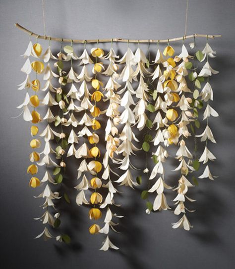 Paper flower chains hung on a wooden stick Easter Lily, Forever Flowers, Beach Diy, Tiki Party, Beach Theme Wedding, Ceremony Backdrop, Flower Backdrop, Flower Garlands, Fake Flowers