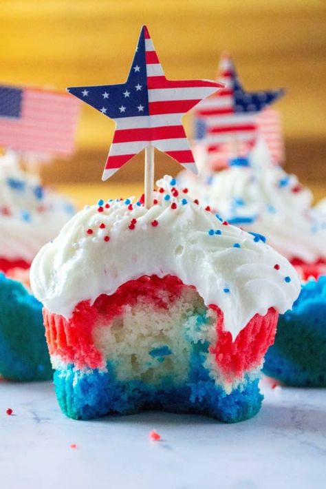 Red White and Blue Patriotic Cupcakes are the perfect Fourth of July Cupcakes to show off your American pride. Made using a box cake mix and topped off with homemade buttercream frosting, these red, white and blue layered cupcakes will be the star of every Fourth of July dessert table. | A Wicked Whisk #redwhitebluecupcakes #redwhitebluedesserts #redwhitebluedesserts4thofjuly #redwhitebluedessertsmemorialday #redwhitebluecupcakes4thofjuly #redwhitebluecupcakesamericanflag Layered Cupcakes, 4th Desserts, Fourth Of July Dessert, Patriotic Snacks, Patriotic Cupcakes, Lemon Cupcake, Homemade Buttercream, Passover Desserts, Homemade Buttercream Frosting