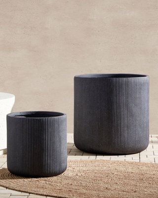 Elevate your gardening game with this outstanding ribbed outdoor plant pot. Crafted from a fusion of clay reinforced with glass fibre, this pot harmoniously marries style with resilience. Its textured ribbed surface adds an artistic touch to any space, while the solid universal hue complements all botanical beauties. Unleash your creativity as you curate lush gardens that thrive in any weather—this pot fearlessly stands against water, high heat, and icy chills. Outdoor Plant, Botanical Beauty, Lush Garden, Outdoor Plants, Plant Pot, Flower Pot, Potted Plants, Flower Pots, Lush