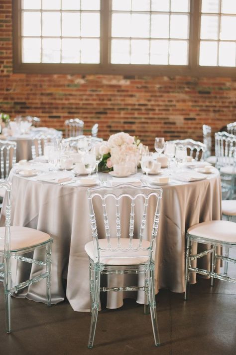 Neutral minimalist wedding decor, champagne table cloth and clear acrylic chairs Purple And Silver Wedding, Clear Chairs, Table Arrangements Wedding, Minimalist Wedding Decor, Acrylic Chair, Matric Dance, Brewery Wedding, Ghost Chairs, Chair Options