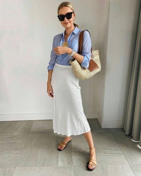 That blue shirt, always a classic, always chic. Source of... Loewe Basket Bag, Lydia Tomlinson, Midi Skirt Style, Everyday Casual Outfits, Summer Attire, Style Edit, Satin Midi Skirt, Street Style Summer, Skirt Style