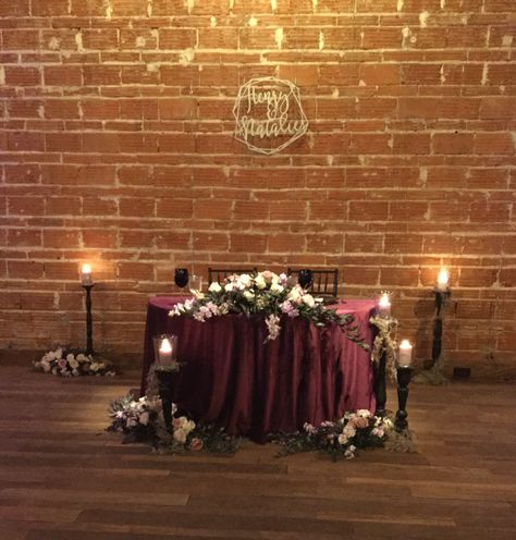 Nova 535 wedding. Sweetheart table. Southern Gothic theme Black And Burgundy Sweetheart Table, Sweetheart Table Wedding Dark And Moody, Goth Bride And Groom Table, Gothic Wedding Sweetheart Table, Gothic Bride And Groom Table, Moody Wedding Sweetheart Table, Gothic Sweetheart Table Wedding, Dark And Moody Sweetheart Table, Halloween Sweetheart Table