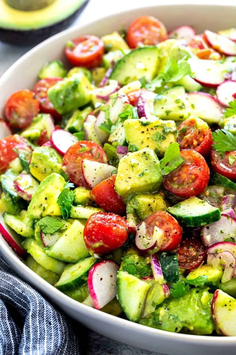 Fresh avocado salad recipe with cilantro lime dressing. A healthy side dish in just 30 minutes that pairs nicely with barbecued foods and other proteins. #avocado #avocadosalad #cincodemayo #july4th #summersidedish #sidedish