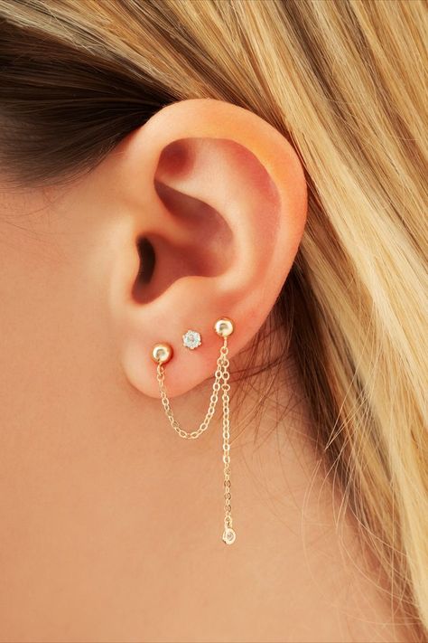 This double pierced earring can be styled multiple ways, pair with another style for a mismatched look or add a gemstone stud between for a three stud look. The 14KT Yellow Gold Style is a unique look for the person who loves fashion. Handcrafted in USA Alloy/Metal: 14KY Stone Type: Precious Stone Color: Diamond Stone Specifications: .03 CTTW Closure Type: Post / Clutch Height (in): 1.300 Width (in): .300 Sold Individually Double Pierced Earrings, Gemstone Studs, Stud Earring, Diamond Stone, Gold Style, Precious Stones, Stone Color, Ear Cuff, Diamond Earrings