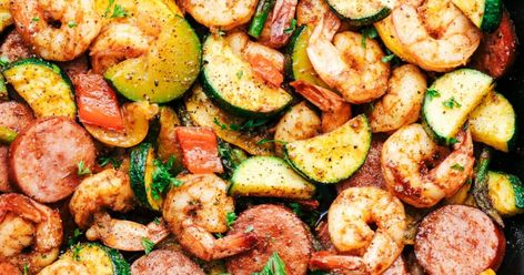 Try this healthy and delicious shrimp recipe from therecipecritic.com! Includes summer veggies zucchini, yellow squash, asparagus, and red bell pepper, making it a complete meal in one. Sausage And Shrimp Recipes, Cajun Shrimp And Sausage, Vegetable Skillet, Shrimp Zucchini, Shrimp And Sausage, Shrimp Sausage, Summer Veggies, Cajun Shrimp, Shrimp Dishes