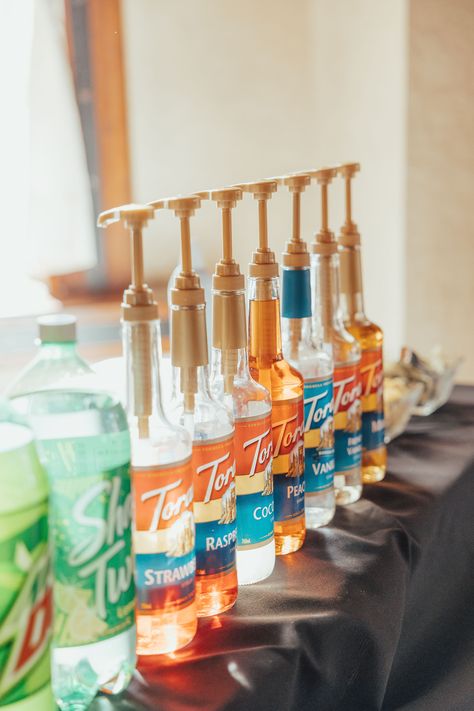 Torani syrups for soda bar. Fun addition to a wedding! #ad @photobykenn Soda Bar Wedding, Fruit Syrups For Drinks, Flavor Syrups For Drinks, Torani Syrup Cocktail Recipes, Soda Stream Syrup Recipes, Bar Syrups, Drinks Using Torani Syrups, Coffee Syrup Dispenser, Drink Shelf