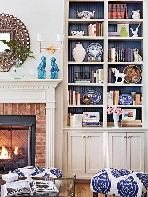 Decorating can be difficult, but with a few little tweaks, you can make it look like a professional designed your home! Flip through these tips for decorating any room in your home. Our ideas include editing down your decor, going for symmetry, and adding white space to a large room. Bookcase Styling, Bookshelf Styling, Built In Bookcase, Book Case, Shelf Styling, A Living Room, Book Shelf, Decorating On A Budget, My New Room