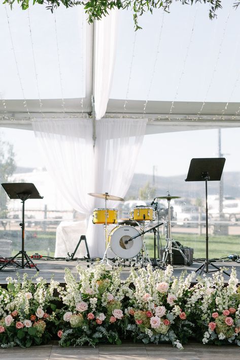 Flowers In Front Of Stage Wedding, Florals In Front Of Stage Wedding, Stage Flowers, Floral Hedge, Wedding Band Stage Flowers, Wedding Band Stage Florals, Wedding Music Band Stage, Tent Floral Installation, King Birthday