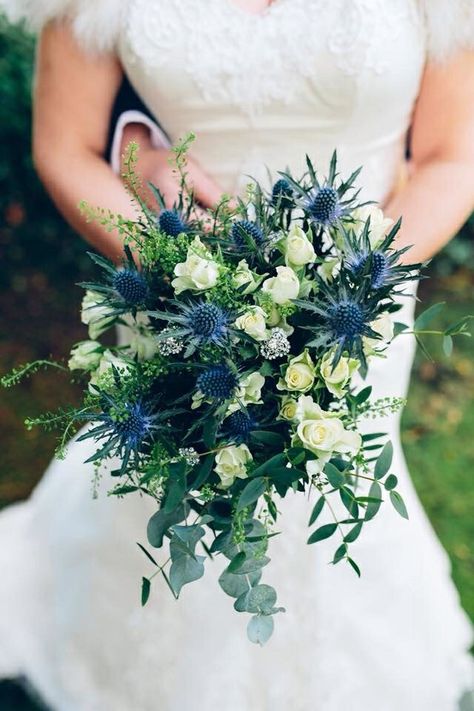 Bride's Gorgeous Bouquet Features: Ivory Spray Roses, Blue Eryngium Thistle, Green Eucalyptus + Additional Greenery and Foliage Thistle Wedding Flowers, Thistle Bouquet Wedding, Thistle Bouquet, Hand Tied Bridal Bouquet, Winter Bridal Bouquets, Small Bridal Bouquets, Thistle Wedding, Holly Wedding, Blue Thistle