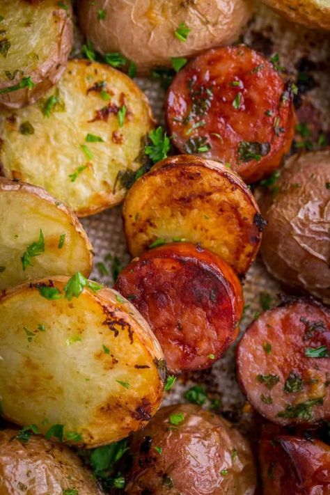 Roasted Potatoes and Kielbasa (One-Pan Recipe) - NatashasKitchen.com One Pan Kielbasa, Roasted Potatoes And Sausage, Sausage Recipes Potatoes, Potatoes And Kielbasa, Kilbasa Sausage Recipes, Easy Kielbasa Recipes, Kielbasa Sausage Recipes, Copycat Recipes Desserts, Potatoes And Sausage