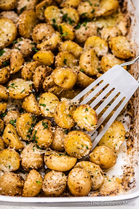 These zesty Italian dressing potatoes are an easy and flavorful side dish to accompany any meal. They're cooked in Italian dressing, baked to crispy perfection, then sprinkled with parmesan. The best part is they're simple to make and ready in under an hour! #theendlessmeal #italiandressingpotatoes #roastpotatoes #bakedpotatoes #potatoes #italian #italiandressing #easyside #healthyside #potatorecipe #italianrecipe Easy Air Fryer Potatoes, Parmesan Potato Recipe, Air Fryer Potatoes, Eggs Potatoes, Greek Lemon Potatoes, Italian Dressing Recipes, Italian Potatoes, 2023 Recipes, Zesty Italian Dressing