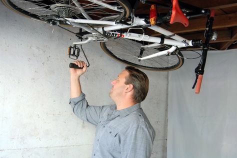 Hide‐A‐Ride bike takes the high road to bike storage Bike Storage Garage Ceiling, Inventions Sympas, Bike Storage Garage, Cycle Storage, Bike Lift, Bicycle Track, Ride Bike, Bicycle Storage, Take The High Road