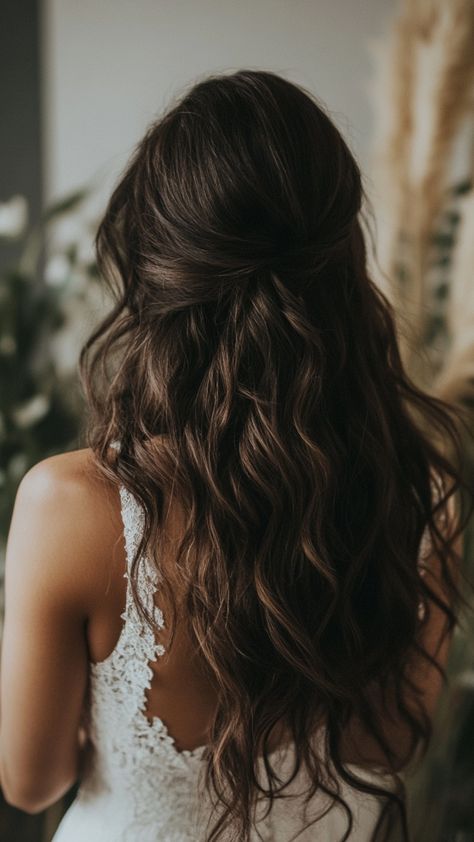 Looking for elegance on your wedding day? These 57 hairstyles for dark-haired brides bring sophistication to the next level. Choose from polished updos or flowing curls to match your bridal style. Discover them all now! #elegantbride #darklocks #bridalhairstyles Wedding Hairstyle Brunette, Hair Ideas For Bridesmaids Down, Wedding Hairstyles For Long Hair Brown, Bridal Hairstyles Down Medium Length, Brunette Wedding Hairstyles With Veil, Hair Styles For Long Hair Length Wedding, Half Ip Wedding Hair, Bridal Hair Dark Brown, Wedding Hairstyles For Long Dark Hair