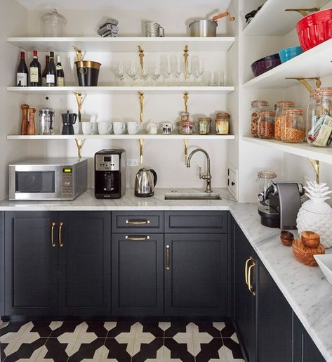 Butler's Pantry - The walk-in pantry is 56 square feet (about 5 square meters). Zaveloff used a graphic encaustic cement tile floor in here. The space holds small appliances, including a coffee station. Having a sink here makes morning drinks easier to prepare. Shaker cabinets painted in Inkwell and brass brackets tie the shelves to the kitchen design. Sleek Kitchen Design, Pantry Renovation, Organized Pantry, Pantry Remodel, Casa Country, Cabinet Remodel, Kitchen Pantry Design, Sleek Kitchen, Kitchen Pantry Cabinets