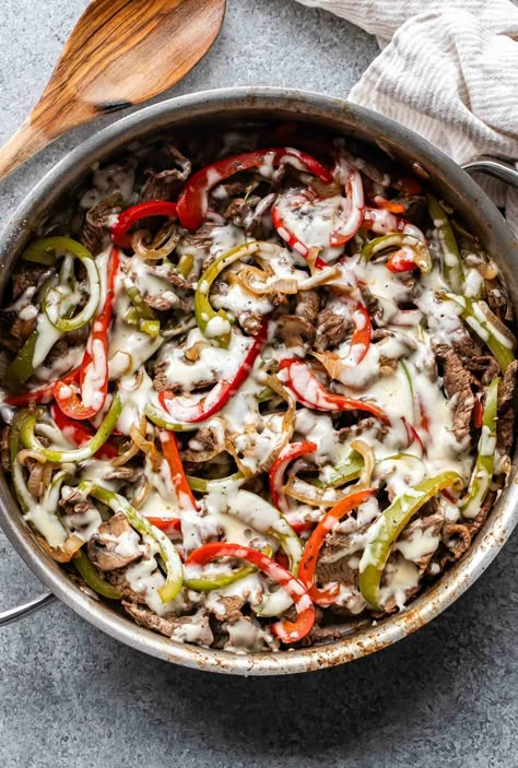 This Philly cheesesteak skillet is the perfect, quick and easy weeknight dinner! Serve it as is or on toasted hoagie rolls and make a cheesesteak sandwich! Ground Beef Philly, Philly Cheesesteak Skillet, Cheesesteak Skillet, 2 Week Meal Plan, Teriyaki Pineapple Chicken, Chicken Cheesesteak, Cheesesteak Sandwich, Menu For The Week, Cheesesteak Stuffed Peppers