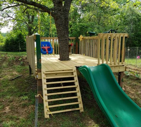 Play Yard Toddler Bed, Outside Tree Decor, Small Diy Playground, Play Structures For Small Yards, Backyard Tree Decorating Ideas, Platform Play Area, Fort Around Tree, Tree Fort Around Tree, Kids Outdoor Play Area Ideas Playground Design