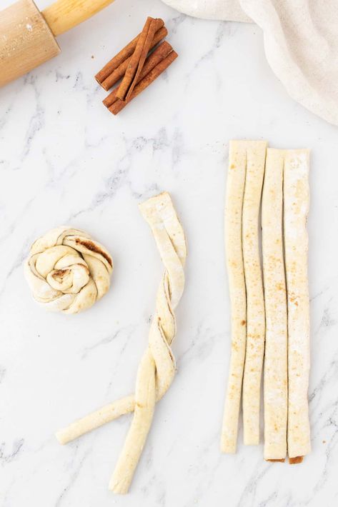 showing two puff pastry strips being twirled around each other. Cinnamon Knots, Cinnamon Twists, Country Cook, The Country Cook, Knots Tutorial, Puff Pastry Sheets, Easy Cinnamon, Pastry Sheets, Pastry Brushes