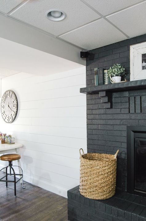 Iron Ore by Sherwin Williams Dark Grey Fireplace Brick, Grey Painted Fireplace, White Plank Walls, Grey Painted Brick, House Fireplace, Painted Fireplace, Grey Fireplace, Painted Brick Fireplace, Painted Brick Fireplaces