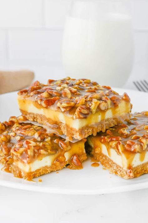 This delicious pecan pie cheesecake bar recipe is a wonderful fall dessert that falls under the category of, if you can't pick just one, have them both! That's right, we can have our cake and eat it too. With pie! No Bake Pecan Cheesecake Bars, Potluck Desserts Fall, Pecan Pie Dessert Ideas, Thanksgiving Pecan Desserts, Easy Fall Potluck Recipes, Thanksgiving Desserts Pecan, Quick And Easy Thanksgiving Desserts, Pecan Pie Cheesecake Bars Recipe, Pecan Cheesecake Pie