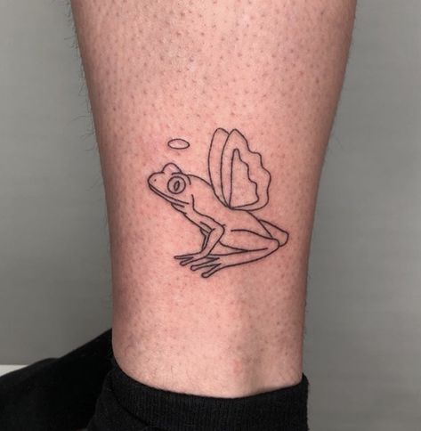 Fancy Frog Tattoo, Mini Frog Tattoo Simple, Frog With Angel Wings Tattoo, Cartoon Frog Tattoo Ideas, Frog Memorial Tattoo, Angel Frog Tattoo, Frog Line Tattoo, Frog Tattoo Outline, Frog With Wings Tattoo