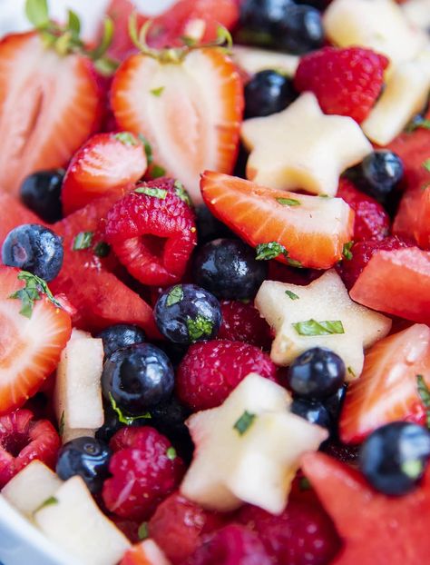 This red, white, and blue fruit salad is such a refreshing, and patriotic dish for your next summer gathering. It's full of strawberries, raspberries, blueberries, watermelon, and apples for a fun, festive side dish that is sure to impress. It's perfect for Memorial Day, Fourth of July, or all summer long. Festive Fruit Salad, Red White And Blue Fruit, 4th July Food, Summer Side Dishes Recipes, Creamy Fruit Salads, Sweet Dressing, Honey Lime Dressing, Dressing For Fruit Salad, Summer Potluck