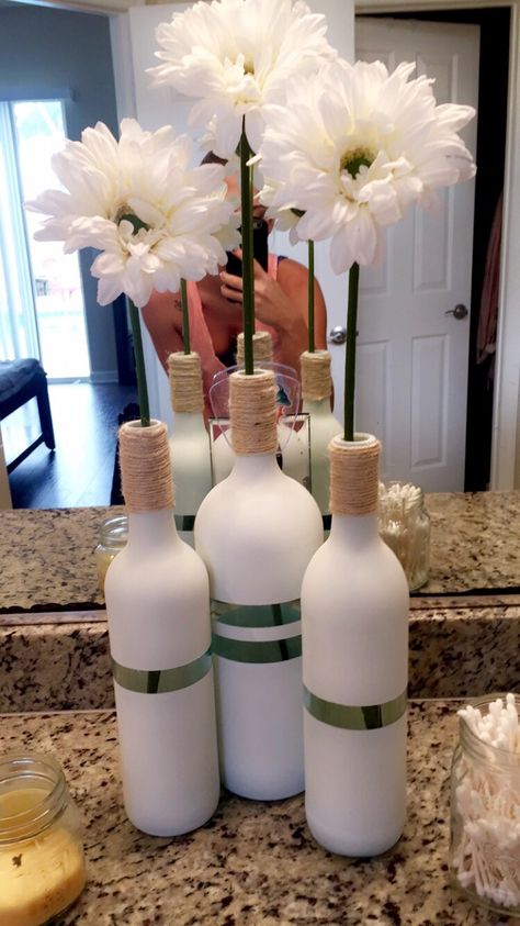 My latest DIY wine bottle project. Using chalk white spray paint, blue masking tape for the lines, rope, and fake flowers :) Diy Wine Bottle, Bottle Projects, Wine Bottle Project, Paint Blue, Bottle Diy, Bottle Craft, Christmas Accents, White Spray Paint, Wine Bottle Diy