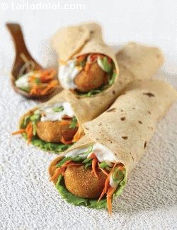 A traditional punjabi starter transforms into an exotic and innovative wrap when combined with fresh veggies like spring onion whites, lettuce and carrots. The addition of mayonnaise binds the flavours of this wrap, and enhances its appeal. To avoid the rajma tikkis from turning soggy, ensure that you drain the cooked rajma and leave it aside in the sieve for at least five minutes, so they become completely dry. Also, don’t forget to coat the tikkis with corn flour. Chatpata Snacks, Lunch Quick, Spinach Wrap, Frankie Recipe, Spinach Wraps, Tiffin Recipe, Wrap Recipe, Cheese Wrap, Packed Lunch