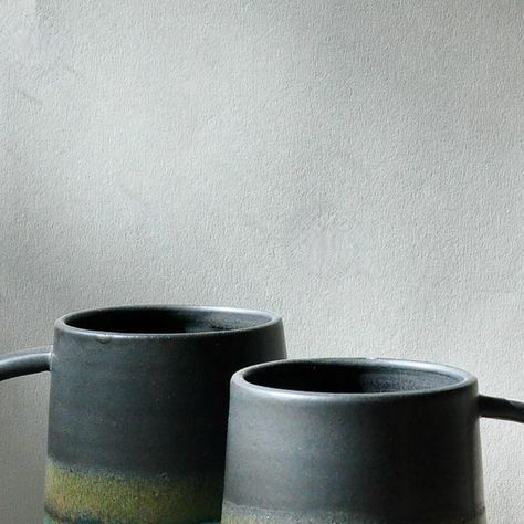 Joanna Oliver on Instagram: "White stoneware Landscape mugs. Stuart Carey’s Black on top and Egypt Blue glazing on the bottom. The landscape happens where the two cross but I have to be careful not to over glaze the join #potters #studiopotter #potterslife #mugs #whitestoneware #ceramics #pottery #contemporaryceramics #designermaker #wheelthrown #pottersofinstagram #glazemagic #simple #handmade #madeinoxfordshire" Sgraffito Ideas, Pottery Sgraffito, Clay Techniques, Instagram White, Ceramics Pottery, Sgraffito, Contemporary Ceramics, Wheel Thrown, The Landscape