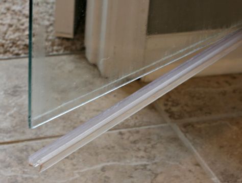 how to clean the plastic strip at the bottom of a glass shower door, bathroom ideas, cleaning tips, It was super super easy to remove plastic strip I just had to grab one end and pull down I did have to use a little muscle and tug quite a bit so keep that in mind if you try it Shower Door Seal, Bathroom Glass Door, Door Stripping, Glass Shower Door, Cleaning Painted Walls, Glass Bathroom, Clean Dishwasher, Glass Shower Doors, Curtains With Rings