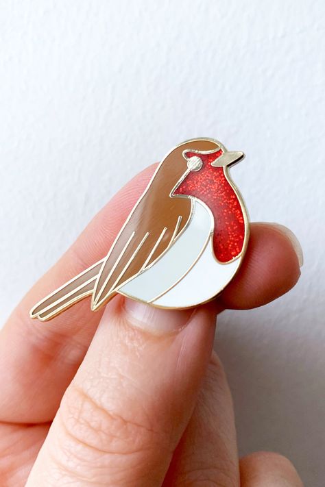 A gorgeous red British robin bird, hard enamel pin badge with red glitter, brown, white, light grey enamel colours and gold plated pin badge with a black rubber fastening. British Robin, Badge Collection, European Robin, Pin Enamel, Robin Bird, Wall Banner, Bird Pins, Bird Watcher, Bird Artwork