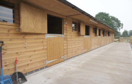 Stable Designs and What You Need to Consider | Equestrian Buildings Small Stable, Horse Stables Design, Feed Room, Stable Block, Equestrian Building, Shingle Roof, American Barn, Self Build Houses, Hay Barn