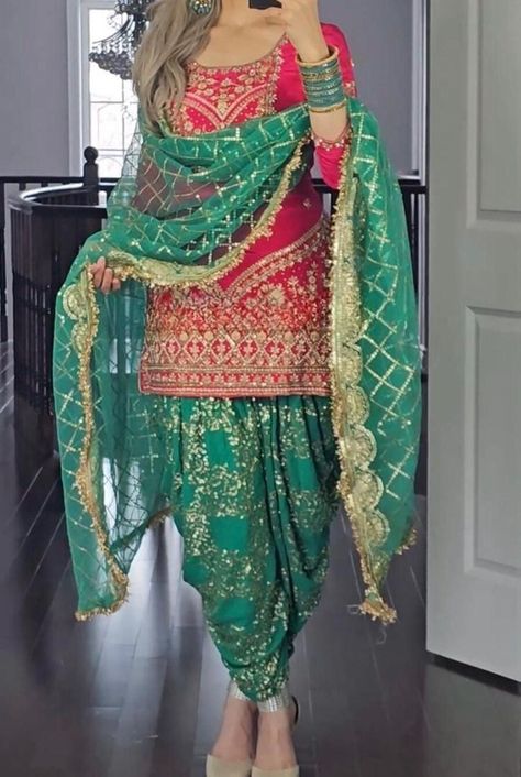 ✨ Eid Special Sale - Elegant Embroidered Dhoti Suit ✨ Description: Celebrate this Eid in style with our stunning Embroidered Dhoti Suit in a striking red and green combination! Designed with intricate golden embroidery, a beautifully embellished dhoti-style salwar, and a matching dupatta, this outfit is perfect for making a statement at festive gatherings. ✨ Eid Exclusive Offer - Limited Stock Available! ✨ ✅ Premium Quality with Heavy Embroidery ✅ Stylish & Comfortable Dhoti-Style Bottoms ✅ Perf