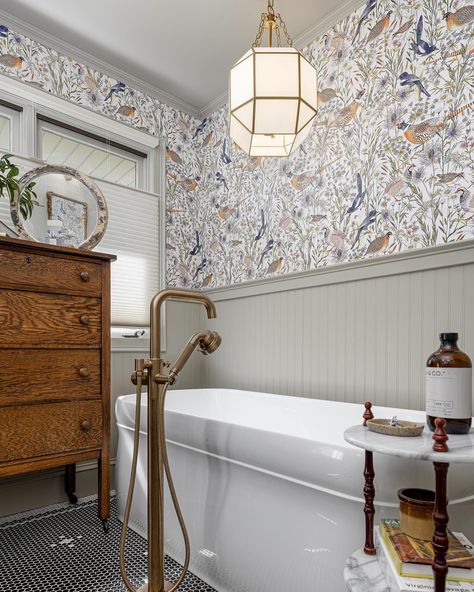 This looks so good! 😍 Michigan-based design studio @proven_kitchenandbath_studio posted these images of this bathroom makeover where they used the Woodland Birds wallpaper. “Sometimes you just need that one inspo item to make the design come to life and for us it was this incredible paper that perfectly captured a vibrant vintage space.” 💕 So many rich features were beautifully implemented from the emerald subway tiles, 💚 black penny tile floors 🖤 and gorgeous brass fixtures. Love every inch... Black Penny Tile, Penny Tile Floors, Birds Wallpaper, Penny Tile, Subway Tiles, Brass Fixtures, Tile Floors, Bird Wallpaper, Vintage Space