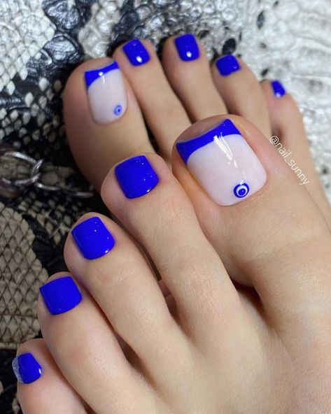 45. Evil Eye & Blue French Tips Most of us have more attention to our fingertips, and forget about our toes. Your fingernails shouldn’t... Dark Blue Toe Nails, Trendy Pedicure, French Toe Nails, Blue Toe Nails, Evil Eye Blue, Feet Nail Design, Evil Eye Nails, Blue French Tips, Gel Toe Nails