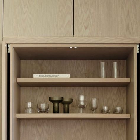 smac studio on Instagram: "CLEVER CABINETRY: Pocket doors on this kitchen cupboard retract back, creating a special area to display bar items and other objects. Arabescato marble on the benchtop is continued inside the cabinetry, making it feel like much more than a storage space.  Photography by @dave_wheeler, editorial styling by @clairedelmar. Timber veneer from @gfethers, items inside cupboard from @spacefurniture, @spenceandlyda, @thedeastore, @fineworks.paddington.  #kitchenstorage #cabinetorganization #storagesolution #organizedkitchen #kitchencabinet #cupboardstorage #decluttered #efficientstorage #kitchenorganization #tidykitchen" Retractable Pocket Doors, Smac Studio, Inside Cupboard, Editorial Styling, Arabescato Marble, Joinery Details, Linen Cupboard, Timber Veneer, Space Photography