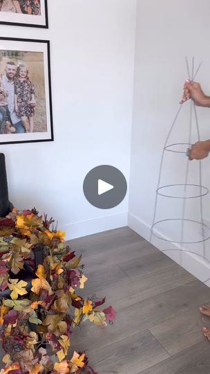 DIY Tomato Cage Fall Tree 🍁🧡 I am so in love with the way this turned out! These are great indoor and outdoor. Plus you can order a bunch of these garlands for such a good price. I think I want to make another one, and pair them together!  I removed the bottom part of the tomato cage so that I could keep the tree looking full. I used 5 garlands, and it gave good coverage. I came through and added some fall stems, not really to fill in holes, but to make the tree look more realistic and I LOVE IT!  I also zip tied each end of my garlands to the cage to keep them in place. 🍁🍁 LTK shop links are in my profile! | Cherish Larsen Tomato Cage Fall Tree, Christmas Trees From Tomato Cages, Christmas Trees With Tomato Cages, Christmas Tree Tomato Cage Easy Diy, Christmas Trees Tomato Cages, Cherish Larsen, Diy Tomato Cage, Tomato Cage Crafts, Fall Stems