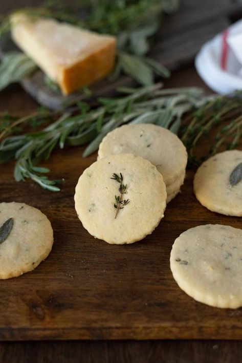 Savory Herb and Parmesan Shortbread Crackers are so good on their own they really don’t need any toppings, or dips. A savory cracker that is perfect to serve when holiday entertaining. Rich and buttery with a little fresh herb flavor and a delicious nutty taste of Parmesan #savoryshortbread #herbparmesanshortbread #shortbreadcrackers Savory Shortbread Recipes, Savoury Shortbread, Nutty Crackers, Savory Shortbread, Parmesan Shortbread, Savory Crackers, Work Treats, Small Pastries, Savory Cookies