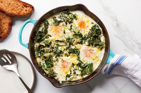 Peppery, Creamy Greens With Eggs recipe | Epicurious.com Egg And Spinach, Brunch Eggs, Mustard Greens, Easy Brunch, 30 Minute Meals, Cast Iron Skillet, Iron Skillet, An Egg, Egg Recipes