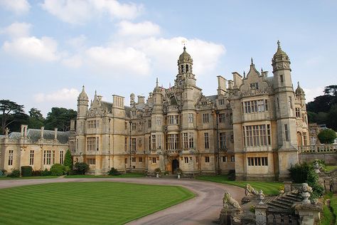 Harlaxton Manor, built in 1837, is a manor house located in Harlaxton, Lincolnshire.  Its architecture, which combines elements of Jacobean and Elizabethan styles with symmetrical Baroque massing, renders the mansion unique among surviving Jacobethan manors.  Harlaxton is first recorded in the Domesday Book as Harleston. Gothic Palace, Harlaxton Manor, English Gothic, Lincolnshire England, Domesday Book, English Houses, English Manor Houses, English Castles, Castle Mansion