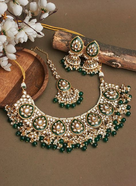 Adorn yourself with exquisite Bridal Kundan Jewellery in stunning shades of green and off white pearls. This Wedding jewellery, inspired by Indian and Pakistani traditions, features intricate designs including Jhumka earrings, Maangtika (forehead ornament), and Punjabi-inspired elements.  With vibrant ivory accents and green Meenakari work, this jewellery set is the perfect complement to your Indian wedding ensemble, radiating timeless beauty and capturing the essence of cultural heritage. Item includes: Necklace, earrings and maangtika Ready to be shipped with love from New Delhi, India  Please leave your phone number in notes or message when placing order for this item. Green Ivory Wedding, Green Jewellery Set, Bridal Kundan Jewellery, Wedding Jewellery Indian, India Necklace, Wedding Pearls, Wedding Planner Checklist, Kundan Jewellery Bridal, Green Themed Wedding