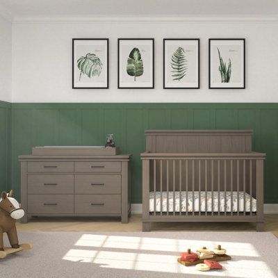 Using exclusively 90-degree design details, the adorning Denman 3-piece nursery set will bring a fresh, transitional feel to your baby’s nursery. This nursery set includes the Denman 4-in-1 Convertible Crib, Denman Double Dresser, and a removable changing table topper so that the dresser unit can be easily converted into a changing surface. Stepped molding and paneling with sophisticated finishes highlight the collection’s unique features. Available in two baby-safe, non-toxic finishes. The 3-pi Two Tone Nursery Walls, Nursery Grey Furniture, Gray Crib Nursery, Dresser Unit, Gender Neutral Baby Nursery, Grey Crib, Changing Table Topper, Wood Nursery, Nursery Dresser