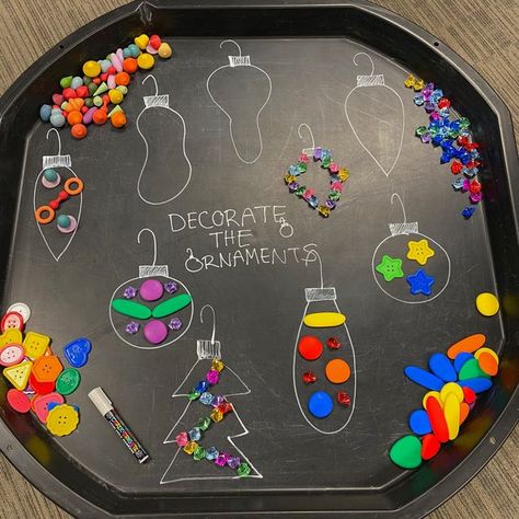 Scholar's Choice on Instagram: "Decorate the Ornaments 🎄 Can you create unique ornaments with the loose parts? 🌈 This is a fun and easy holiday activity that allows children to express their creativity! On your tuff tray take a chalk marker and draw different ornaments of all designs, shapes and sizes! Place different loose parts around your ornaments and then invite children to create and design their own ✨ Ways to extend the play: -Can you make an ornament with a certain amount of loose pa Oshc Christmas Activities, Christmas Activities Tuff Tray, Early Childhood Christmas Crafts, Christmas Theme Tuff Tray, Tuff Tray Ideas For Christmas, First Day Of School Tuff Tray Ideas, Eyfs Outside Provision, Christmas Craft Eyfs Kids, Eyfs Xmas Activities