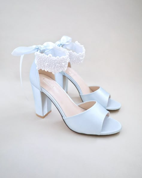 "Satin block heel wedding sandals adorned with all over pearls ribbon strap . Elegance and feminine inspired wear for your special day. The delicate pearl beads are placed to create a graceful classic style. Simple and easy wear for bridal wear, bridesmaids, holiday party, wedding parties, and any special occasions. The light blue color can easily be your something blue. DETAILS: HEELS: 3.75 inches COLORS AVAILABLE: Ivory, White and Light Blue UPPER: Synthetic upper and lining MATERIALS: Manmade outsole ORIGIN: Imported STYLE NAME: SASHA  Not sure of which size to purchase? Shoes measurements are as follow: (Please note measurements taken the length of inside of shoe from toe to heel) SIZE 5 - 9.25\" SIZE 6 - 9.50\" SIZE 7 - 9.75\" SIZE 8 - 10\" SIZE 9 - 10.25\" SIZE 10 - 10.50\"  SIZE 11 Block Heels Wedding, Shoes Wedding Heels, Light Blue Heels, Women Wedding Shoes, Bridal Flats, Wedding Shoes Bride, Satin Shoes, Prom Heels, Wedding Guest Shoes