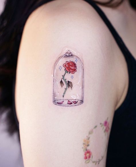 Flower Tattoos (Posts tagged prettytattoo) Disney Rose Tattoo, Rose From Beauty And The Beast Tattoo, Beauty And The Beast Book Tattoo, Beauty And The Beast Flower Tattoo, Disney Beauty And The Beast Tattoo, Beauty And Beast Rose Tattoo, Disney Up Tattoo, Disney Flower Tattoo, Belle Tattoo Disney