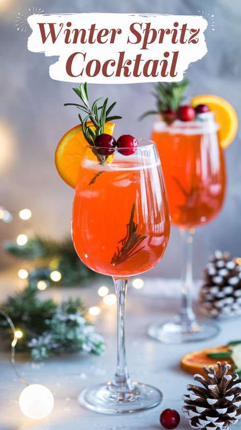 "Discover the perfect Winter Spritz cocktail recipe, a delightful twist on  the classic Aperol Spritz infused with seasonal flavors. This refreshing  cocktail combines the vibrant taste of Aperol with hints of rosemary,  creating a unique and impressive drink ideal for winter gatherings. Explore  our cocktail ideas to elevate your holiday parties and impress your guests  with this easy-to-make recipe. Perfect for those seeking refreshing summer cocktails or unique cocktails to enjoy year-round." Christmas Aperol Spritz, Vodka Holiday Drinks, Winter Spritz, Holiday Vodka Cocktails, Winter Vodka Cocktails, Wine Spritzer Recipe, Peppermint Cocktail, Spritz Aperol, Spritz Drink