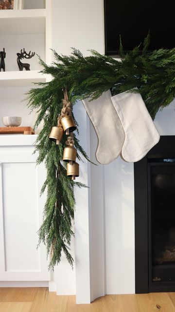 Chimney Garland Christmas, Christmas Garland On Cabinets, Christmas Mantle Bells, Bells On Mantle Christmas, Bells On Garland, Holiday Bells Decor, Vintage Bells Christmas, Garland And Stockings On Mantle, Command Hooks For Garland